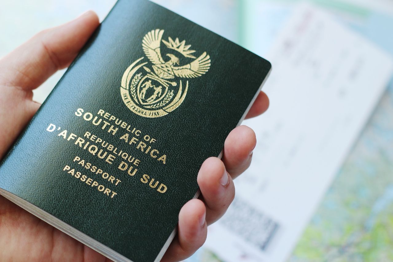 hand-holding-South-African-passport